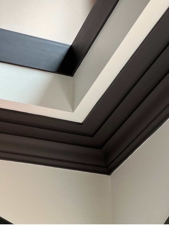 Detailed dark crown molding trim work
